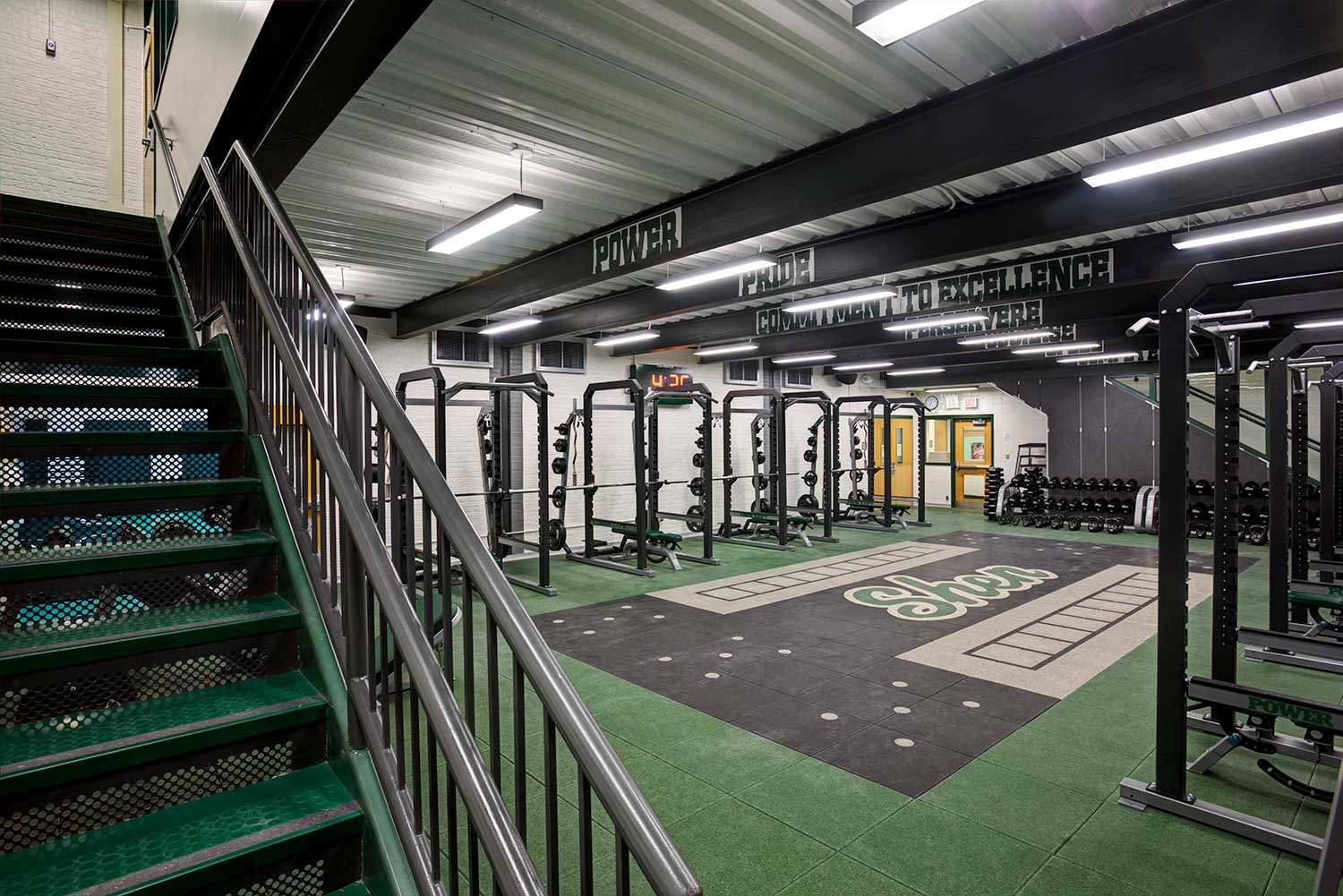 View from the stairwell of the new fitness center weight and exercise room in the athletic complex designed by Mosaic Associates Architects for Shenendehowa Central School District.